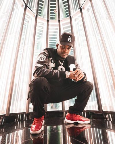 Clifford Taylor posing squatting down